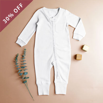 A flatlay of a Organic Footless 2-Way Zipper Romper in White