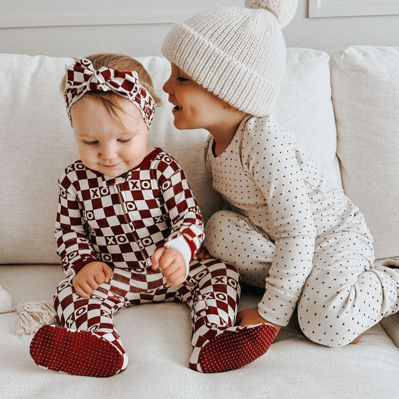 Two children wearing outfits from the Valentine's Collection