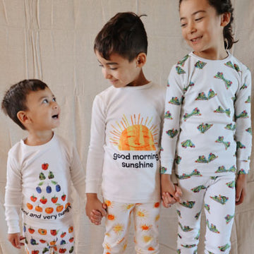 Three children wearing pajamas.