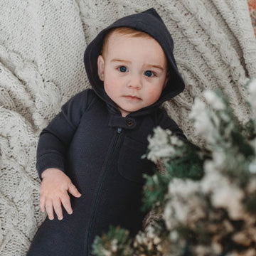 A boy wearing a black outfit.