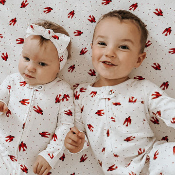 A boy and a girl wearing an outfit from the The World of Eric Carle™ collection.