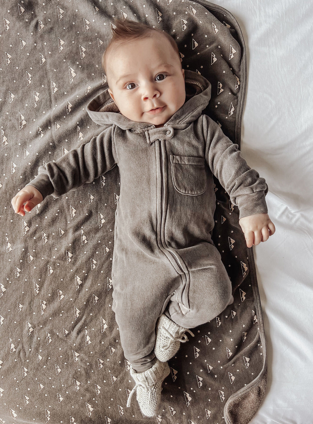 Child wearing Organic Cozy Zipper Romper in Bark.