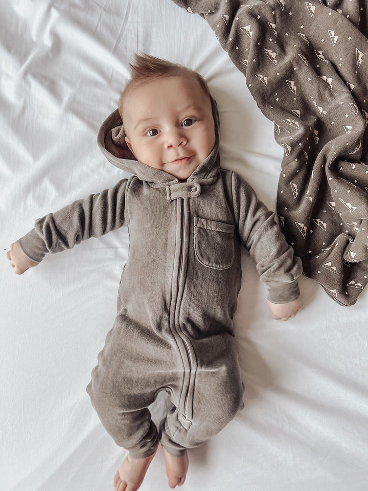 Child wearing Organic Cozy Zipper Romper in Bark.