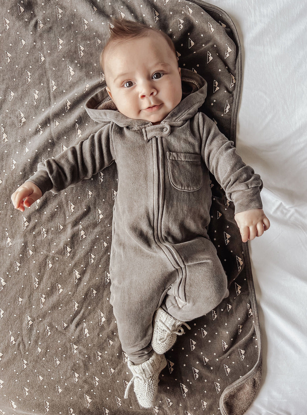 Child wearing Organic Cozy Blanket in Bark Mountains.