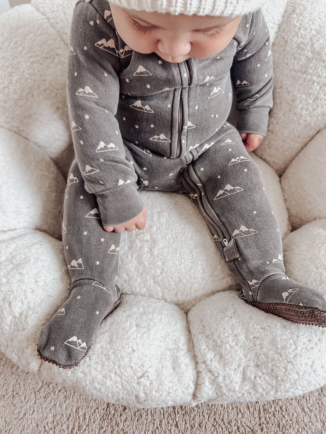 Child wearing Organic Cozy 2-Way Zipper Footie in Bark Mountains.