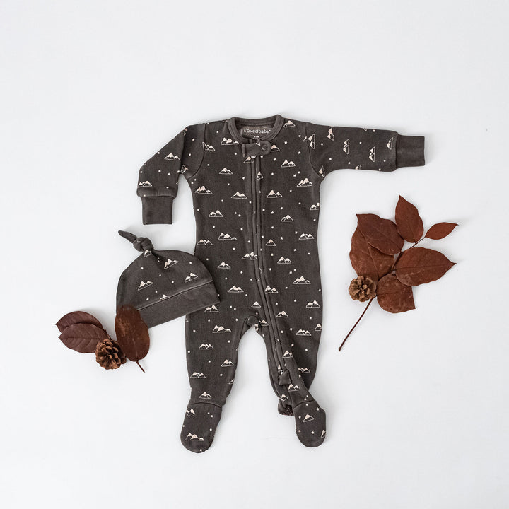 Child wearing Organic Cozy 2-Way Zipper Footie in Bark Mountains.