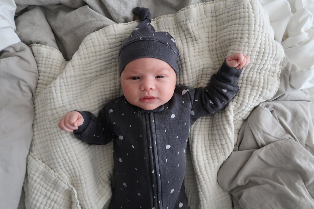 Child wearing Organic Cozy 2-Way Zipper Footie in Coal Clouds.