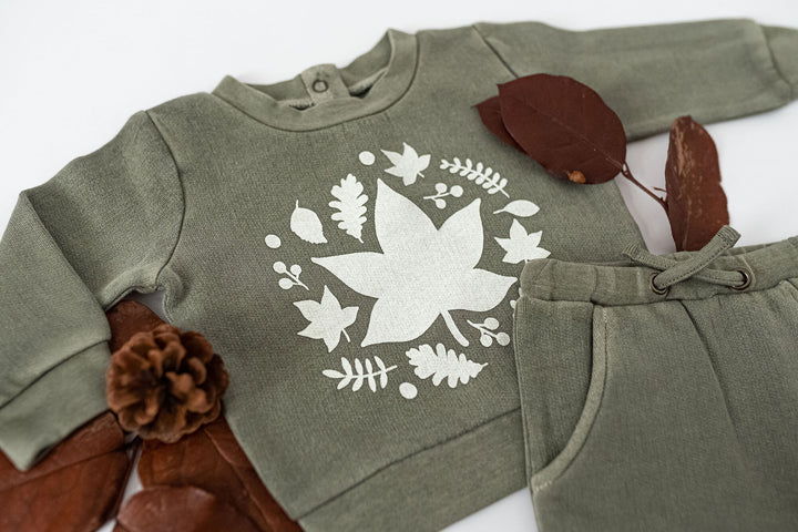 Child wearing Organic Cozy Graphic Sweatshirt & Jogger Set in Hunter Leaves.