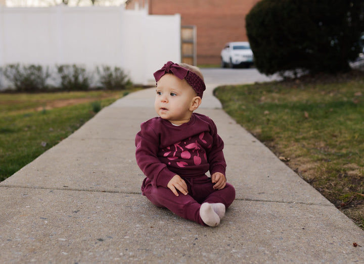 Child wearing Organic Cozy Graphic Sweatshirt & Jogger Set in Sugarplum Cherries.