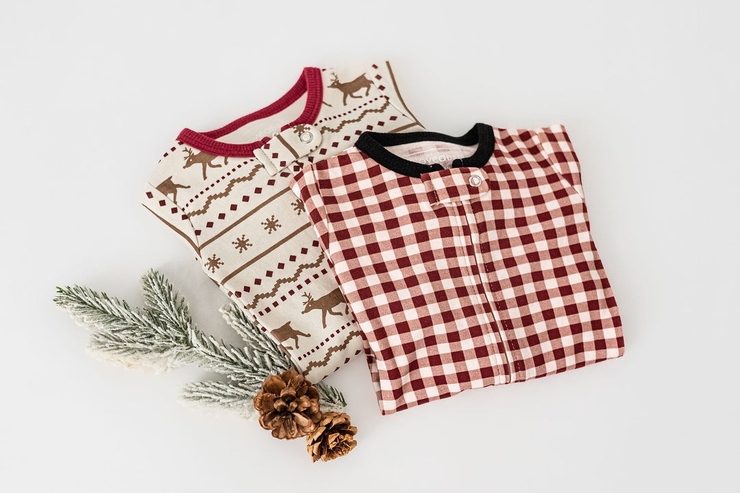 Child wearing Holiday 2-Way Zipper Footie & Cap Set in Crimson Plaid.