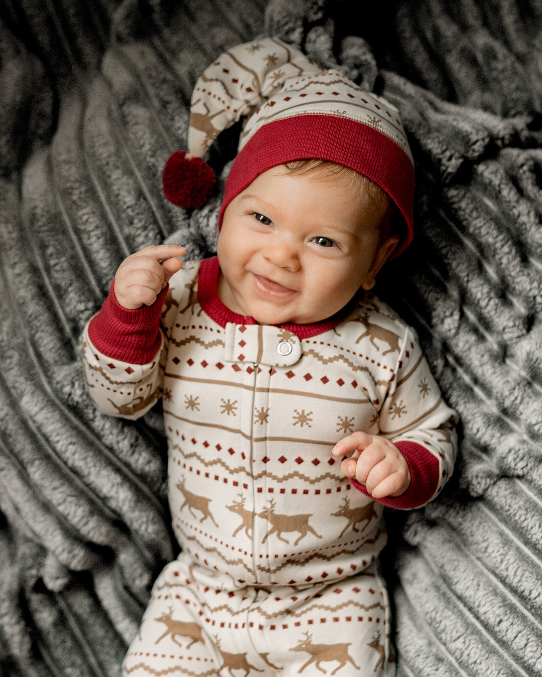 Child wearing Holiday 2-Way Zipper Footie & Cap Set in Fair Isle Rudolph.