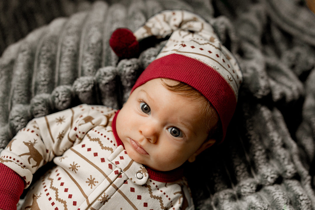 Child wearing Holiday 2-Way Zipper Footie & Cap Set in Fair Isle Rudolph.