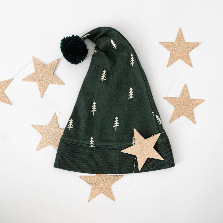 Child wearing Holiday 2-Way Zipper Footie & Cap Set in Pine Trees.