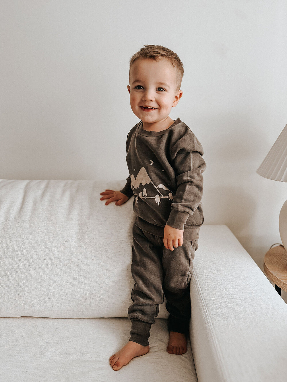 Child wearing Kids' Organic Cozy Graphic Sweatshirt & Jogger Set in Bark Mountains.