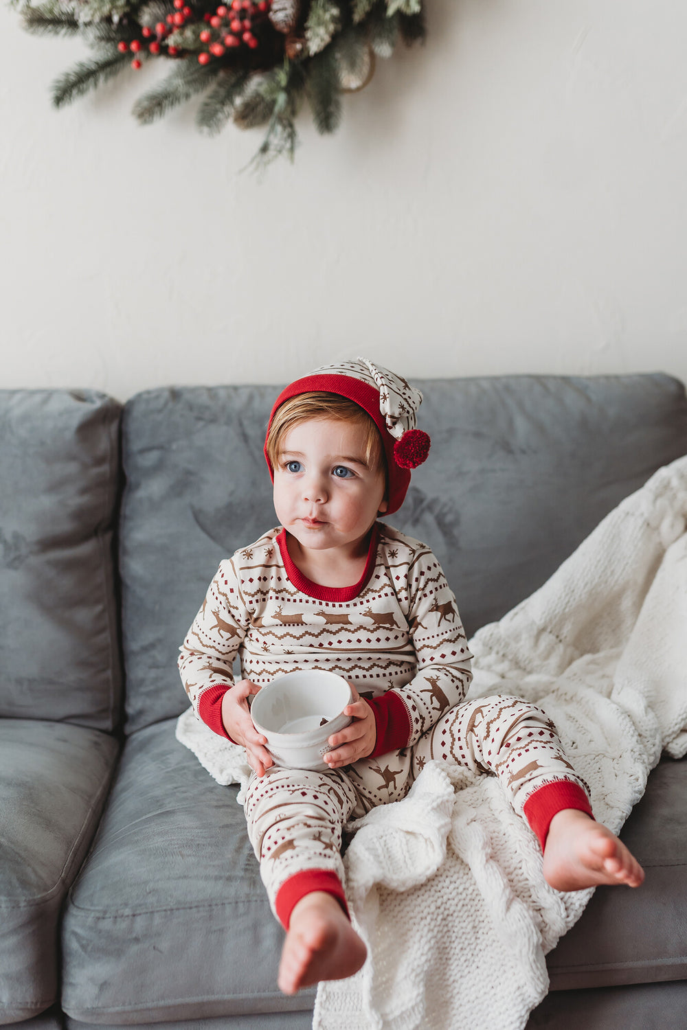 Child wearing Kids' Organic Holiday PJ & Cap Set in Fair Isle Rudolph.