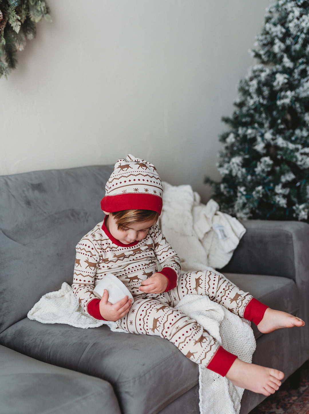 Child wearing Kids' Organic Holiday PJ & Cap Set in Fair Isle Rudolph.