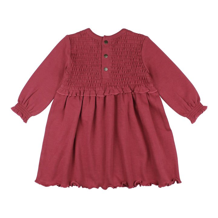 flat image of backside of smocked dress in appleberry color (muted cool red, medium tone)