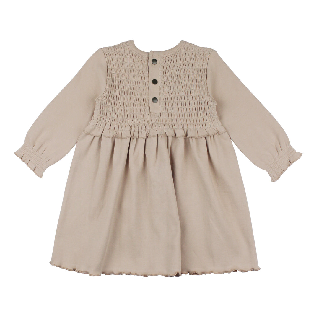 Back view of Kid's Organic Smocked Dress in Oatmeal, a light tan color.