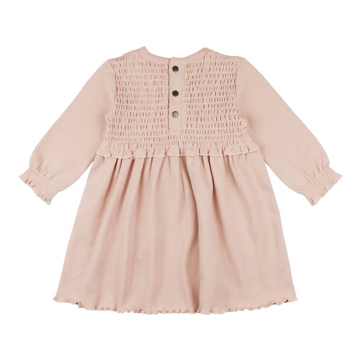 flat image of backside of smocked dress in rosewater color (muted pink, light tone)