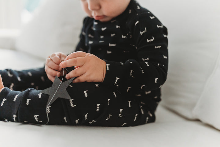 Child Wearing Organic L/Sleeve PJ Set in Boo.