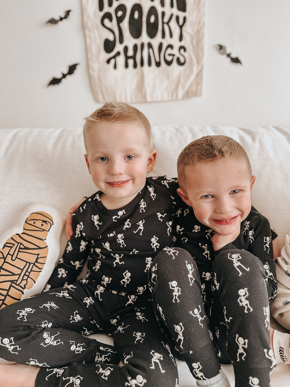 Child wearing Kids' Organic L/Sleeve PJ Set in Dancing Skeletons.