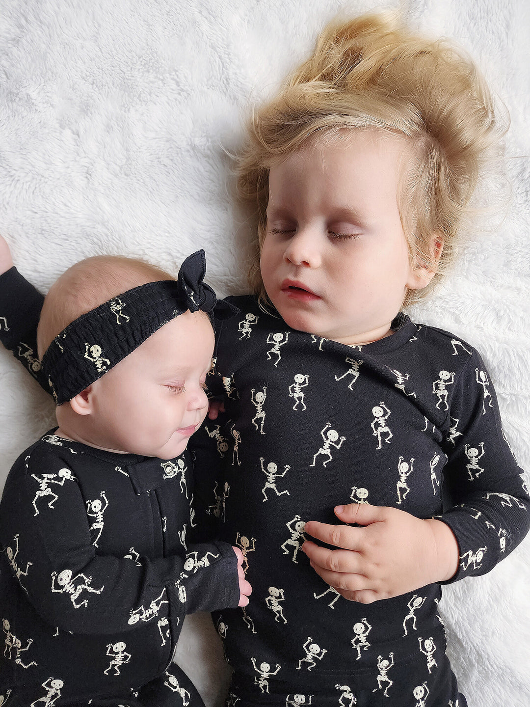 Child wearing Kids' Organic L/Sleeve PJ Set in Dancing Skeletons.