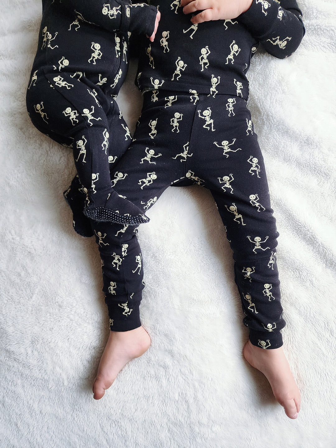 Child wearing Kids' Organic L/Sleeve PJ Set in Dancing Skeletons.