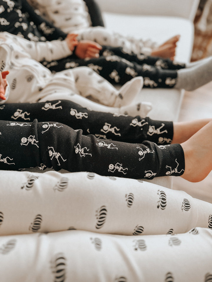 Child wearing Kids' Organic L/Sleeve PJ Set in Dancing Skeletons.