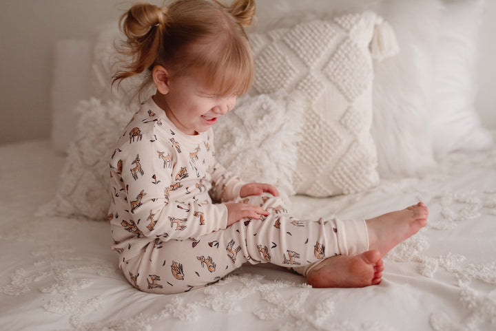 Child wearing Kids' Organic L/Sleeve PJ Set in Doe-a-Deer.