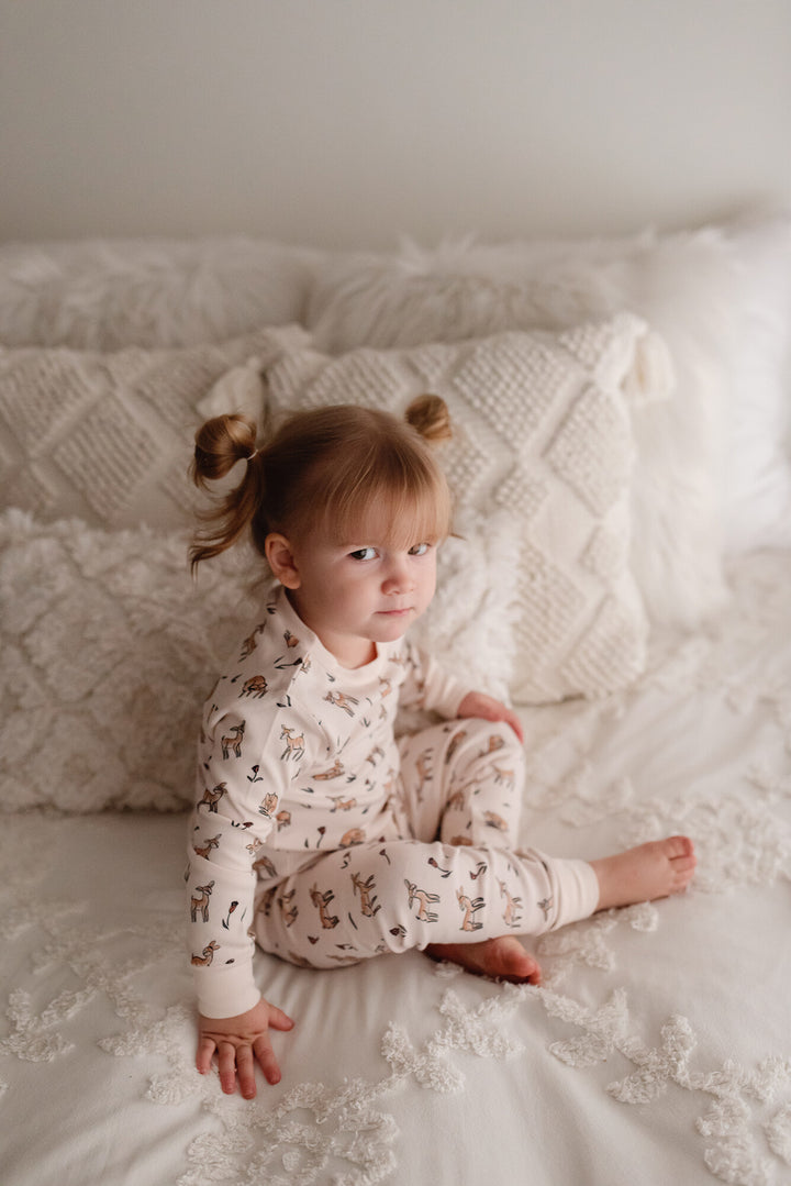 Child wearing Kids' Organic L/Sleeve PJ Set in Doe-a-Deer.