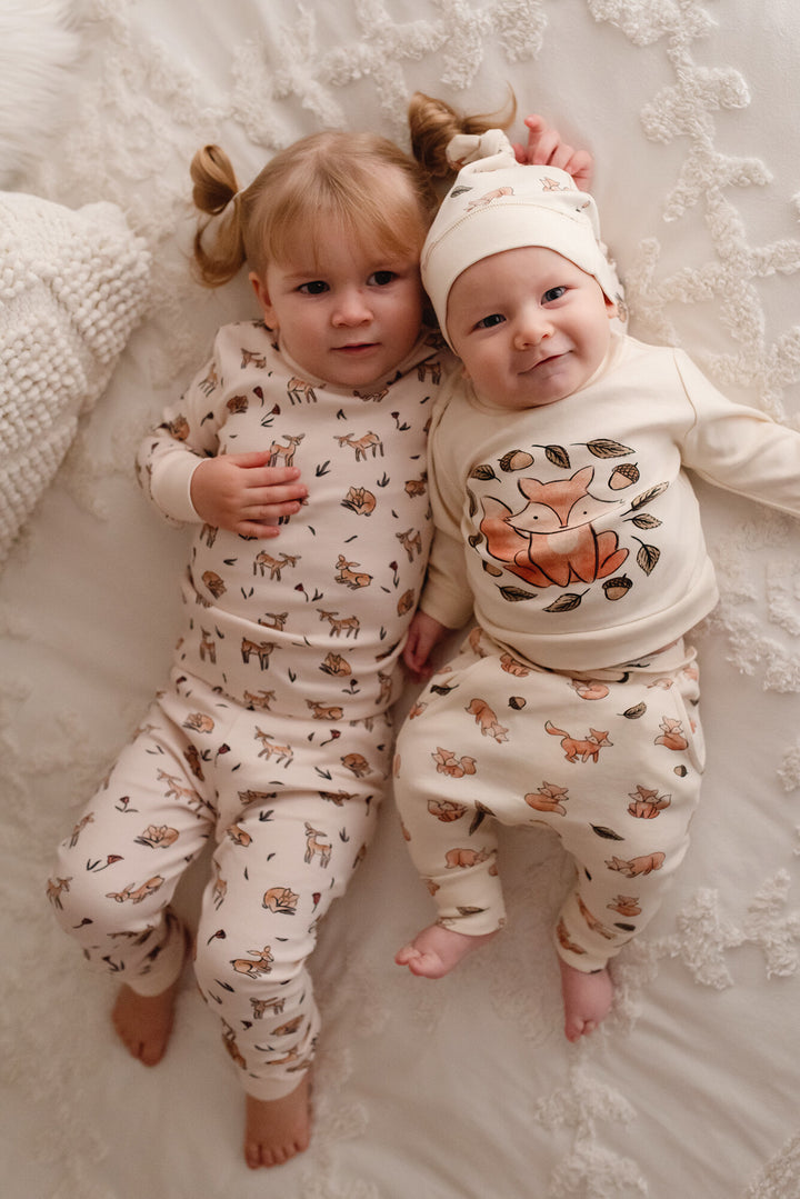 Child wearing Kids' Organic L/Sleeve PJ Set in Doe-a-Deer.