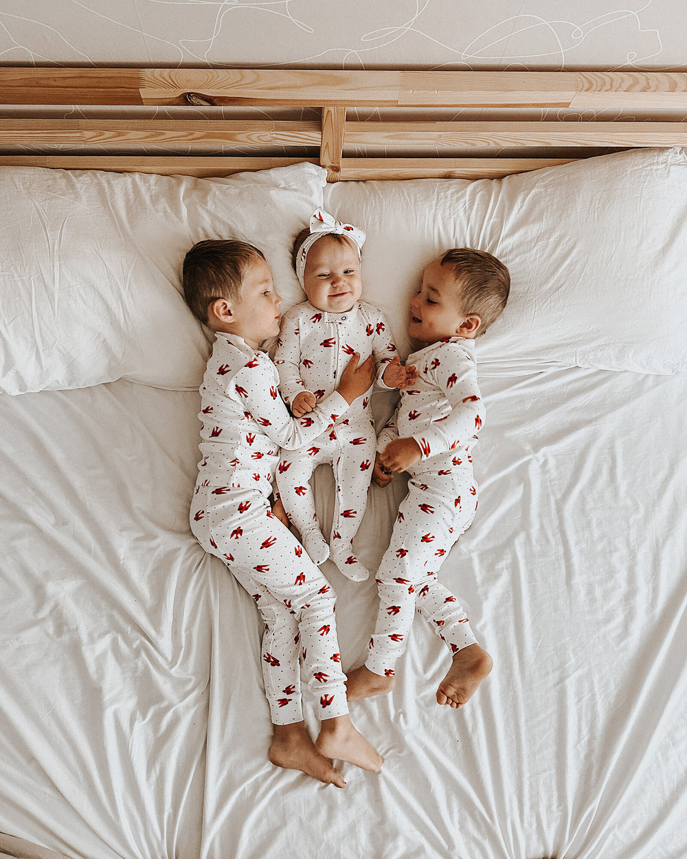 Child wearing Kids' Organic L/Sleeve PJ Set in Red Bird.