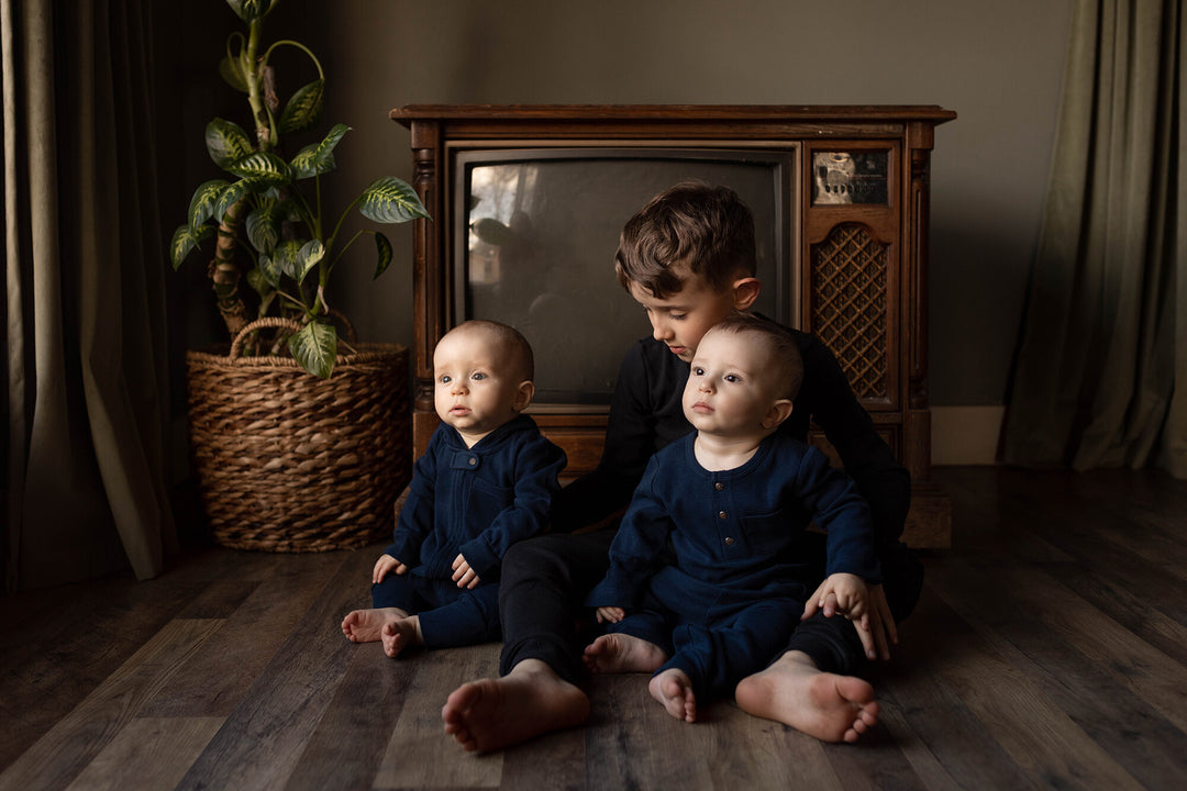 Child wearing Kids' Organic  Thermal Henley & Jogger Set in Black.