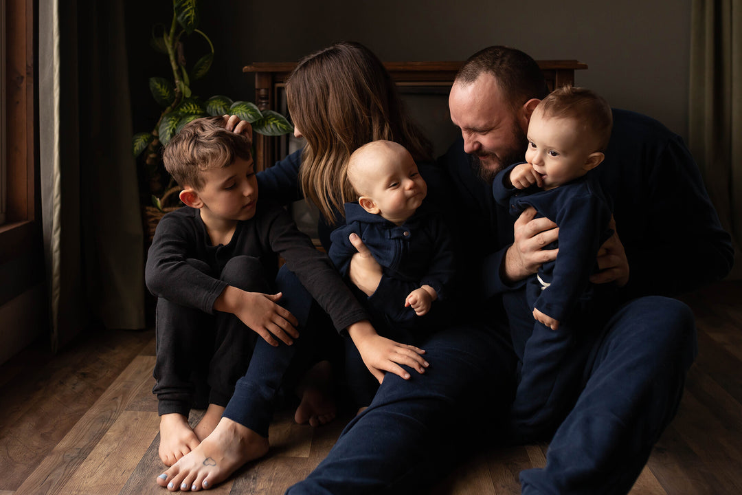 Child wearing Kids' Organic  Thermal Henley & Jogger Set in Black.