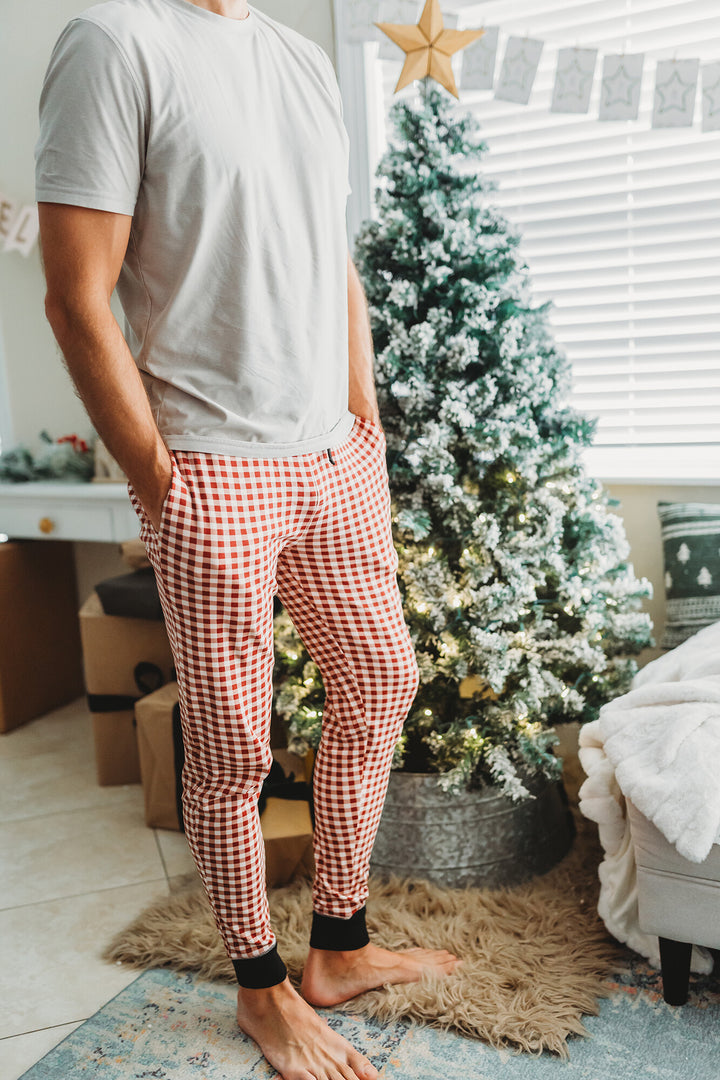 Child wearing Men's Organic Holiday Jogger & Cap Set in Crimson Plaid.