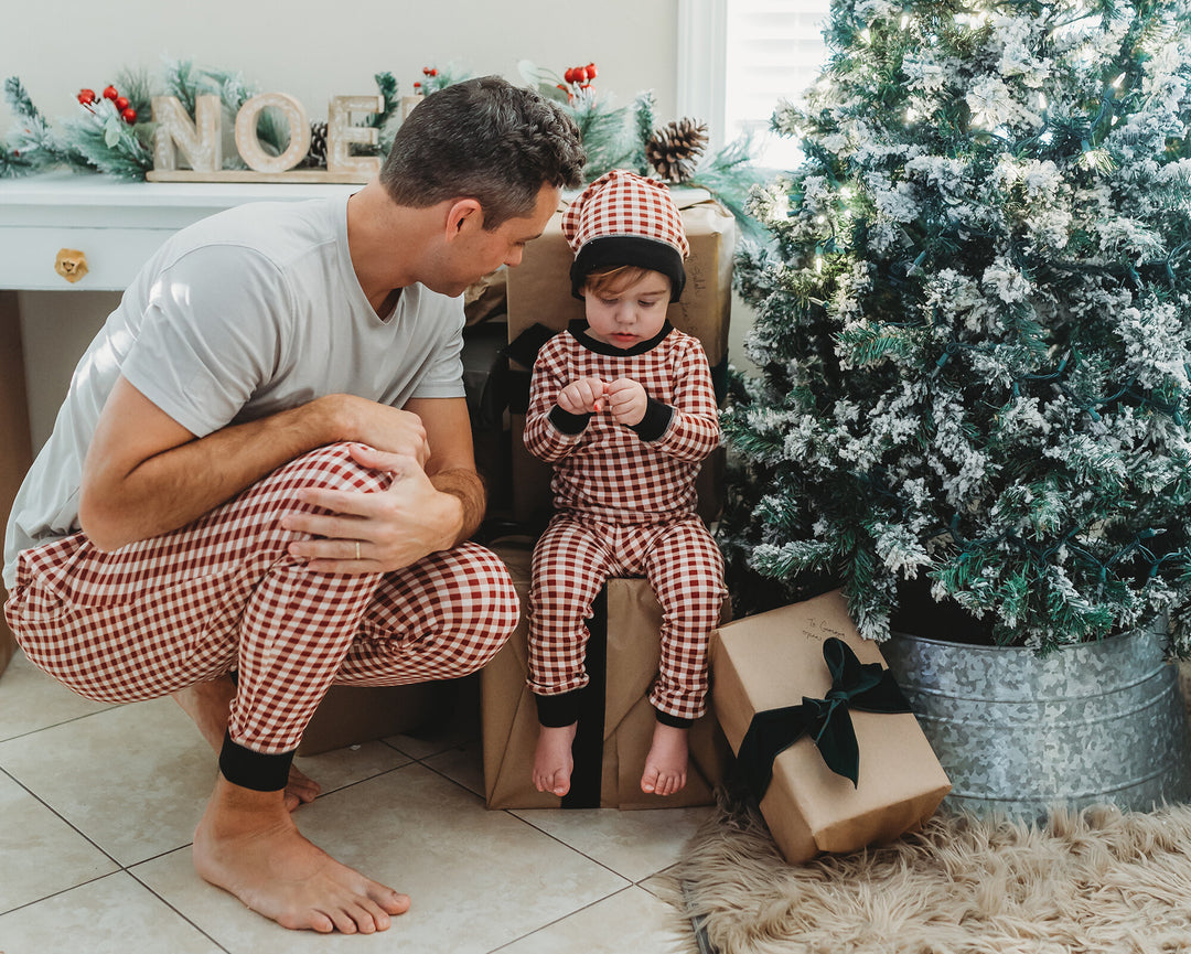 Child wearing Men's Organic Holiday Jogger & Cap Set in Crimson Plaid.