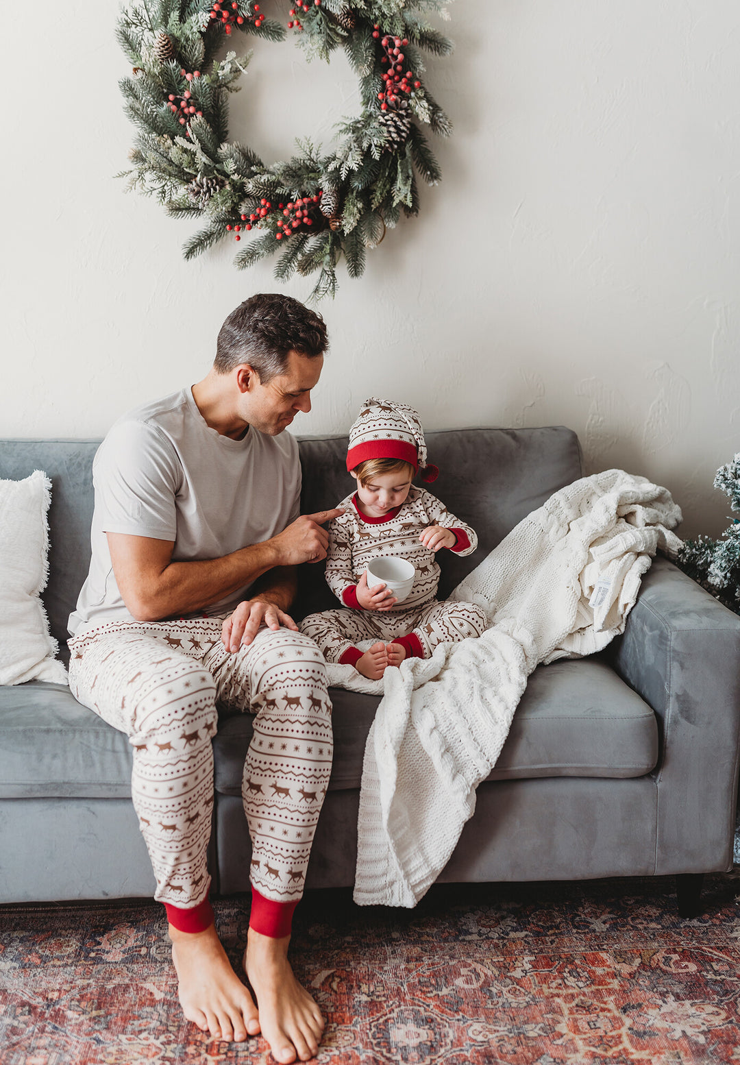 Child wearing Men's Organic Holiday Jogger & Cap Set in Fair Isle Rudolph.