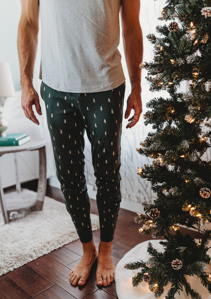 Child wearing Men's Organic Holiday Jogger & Cap Set in Pine Trees.