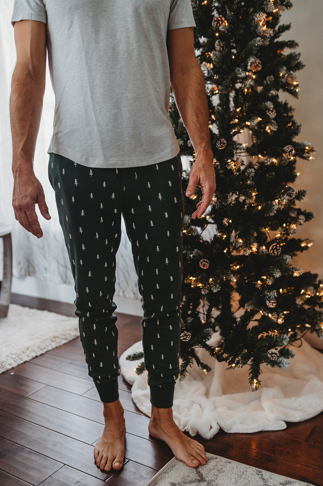 Child wearing Men's Organic Holiday Jogger & Cap Set in Pine Trees.