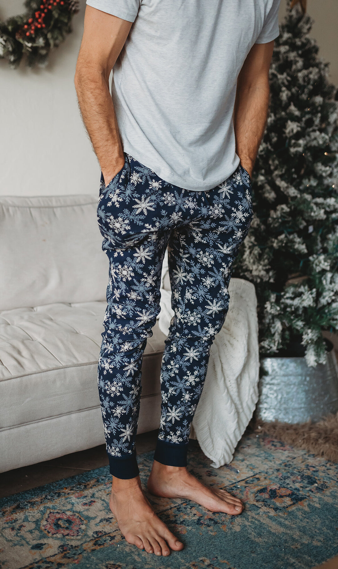 Child wearing Men's Organic Holiday Jogger & Cap Set in Snowflakes.