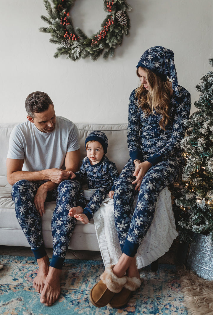 Child wearing Men's Organic Holiday Jogger & Cap Set in Snowflakes.