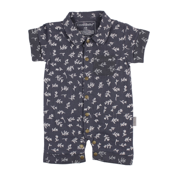 flat image of muslin short sleeve coverall in dusk (dark dusty blue color) with white leaves print