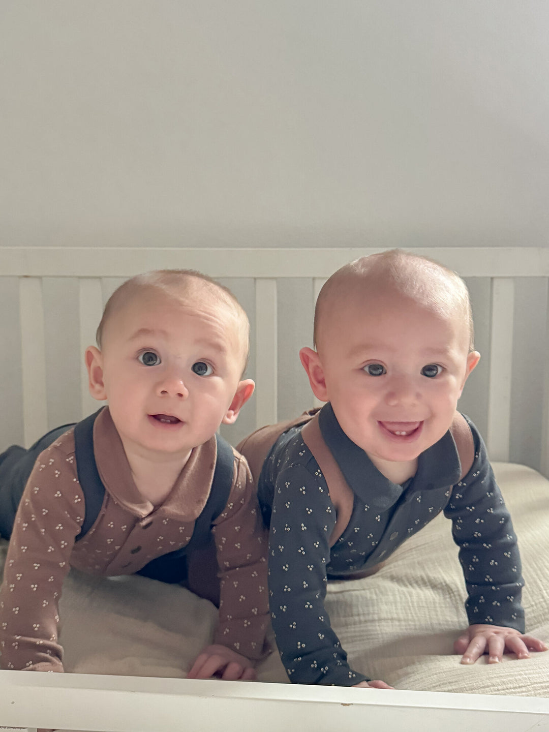 Child wearing Organic Polo Bodysuit in Charcoal Dots.