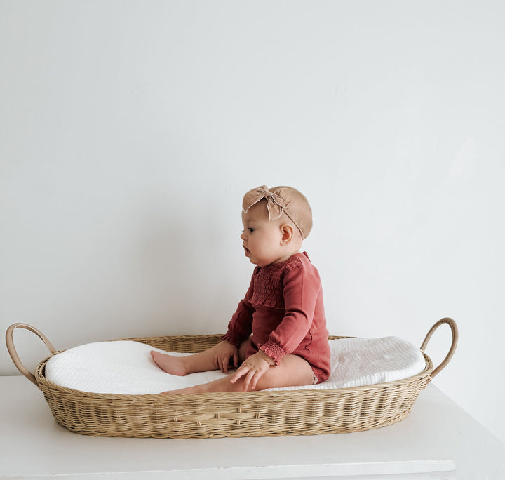 Child wearing Organic Smocked Chest Bodysuit in Appleberry.