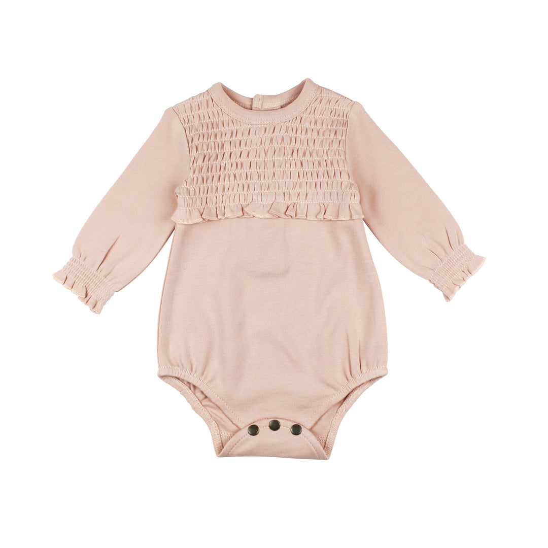 Organic Smocked Chest Bodysuit in Rosewater, a light pink color .