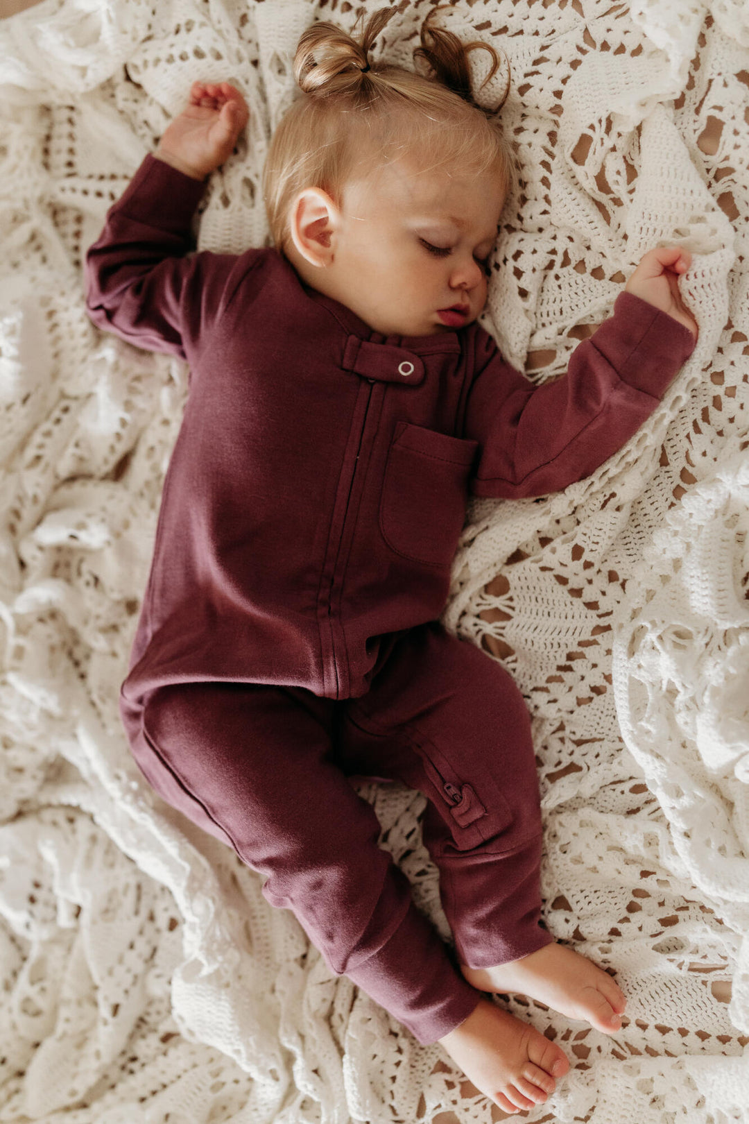 Child wearing Organic Footless 2-Way Zipper Romper in plum