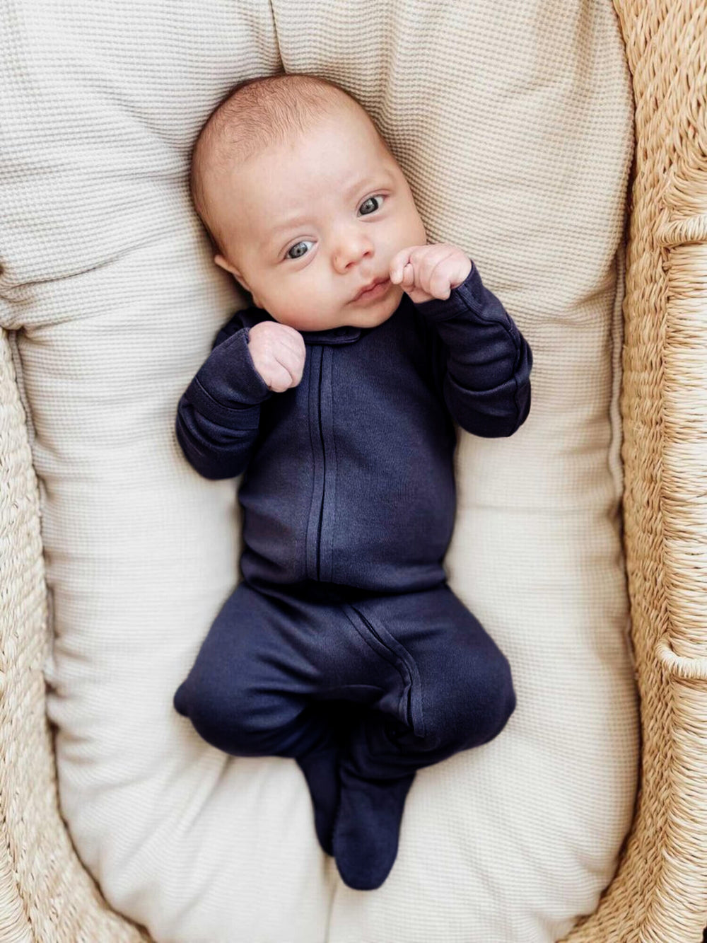 Child wearing Organic 2-Way Zipper Footie in Navy.