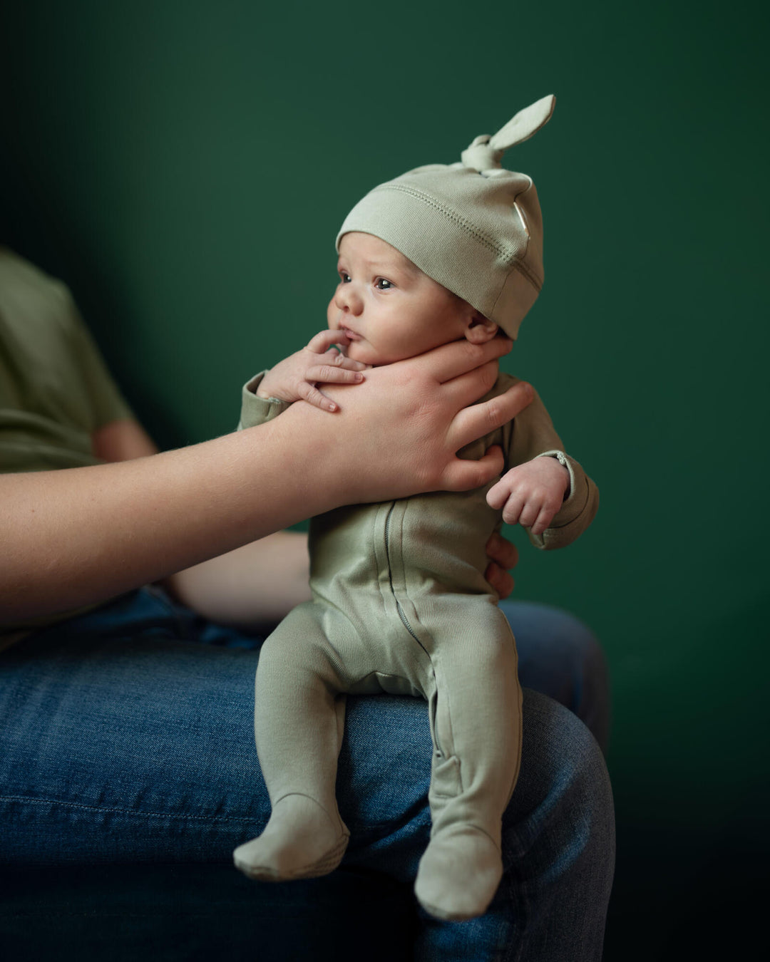 Child Wearing Organic 2-Way Zipper Footie in Seafoam.