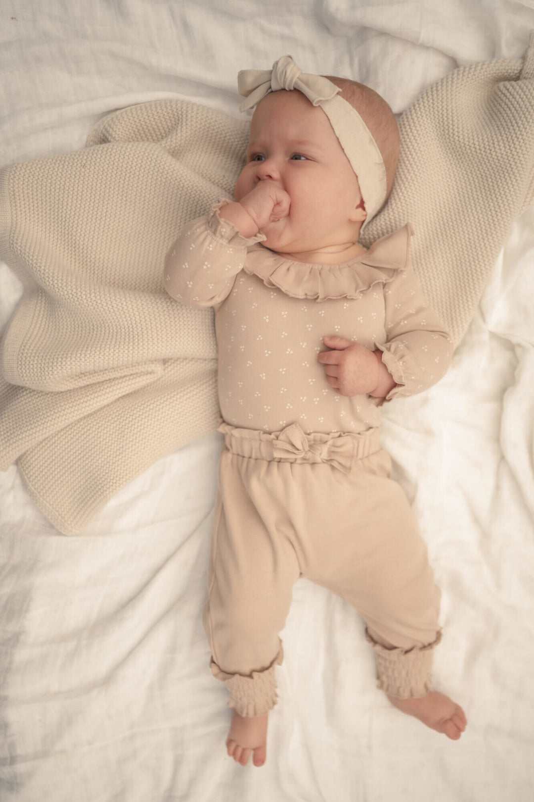 Child wearing Organic Smocked Bubble Pants in Oatmeal.