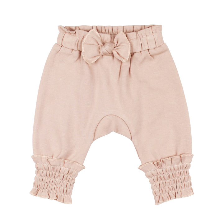 Organic Smocked Bubble Pants in Rosewater, a light pink color .